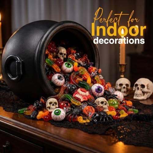 Witch cauldron as an indoor Halloween decoration spilling spooky treats